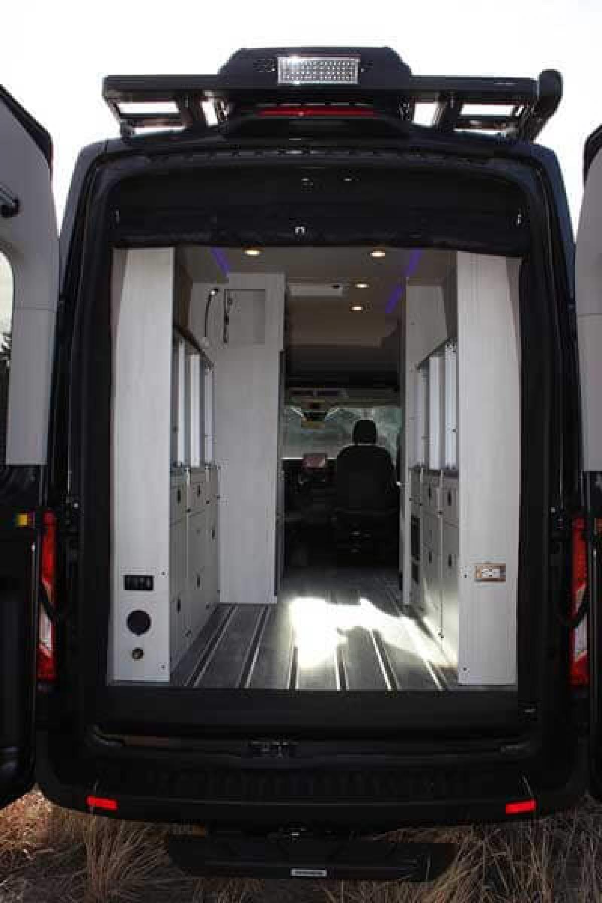 The back of a Pikes Peak Antero Adventure Van with the doors open