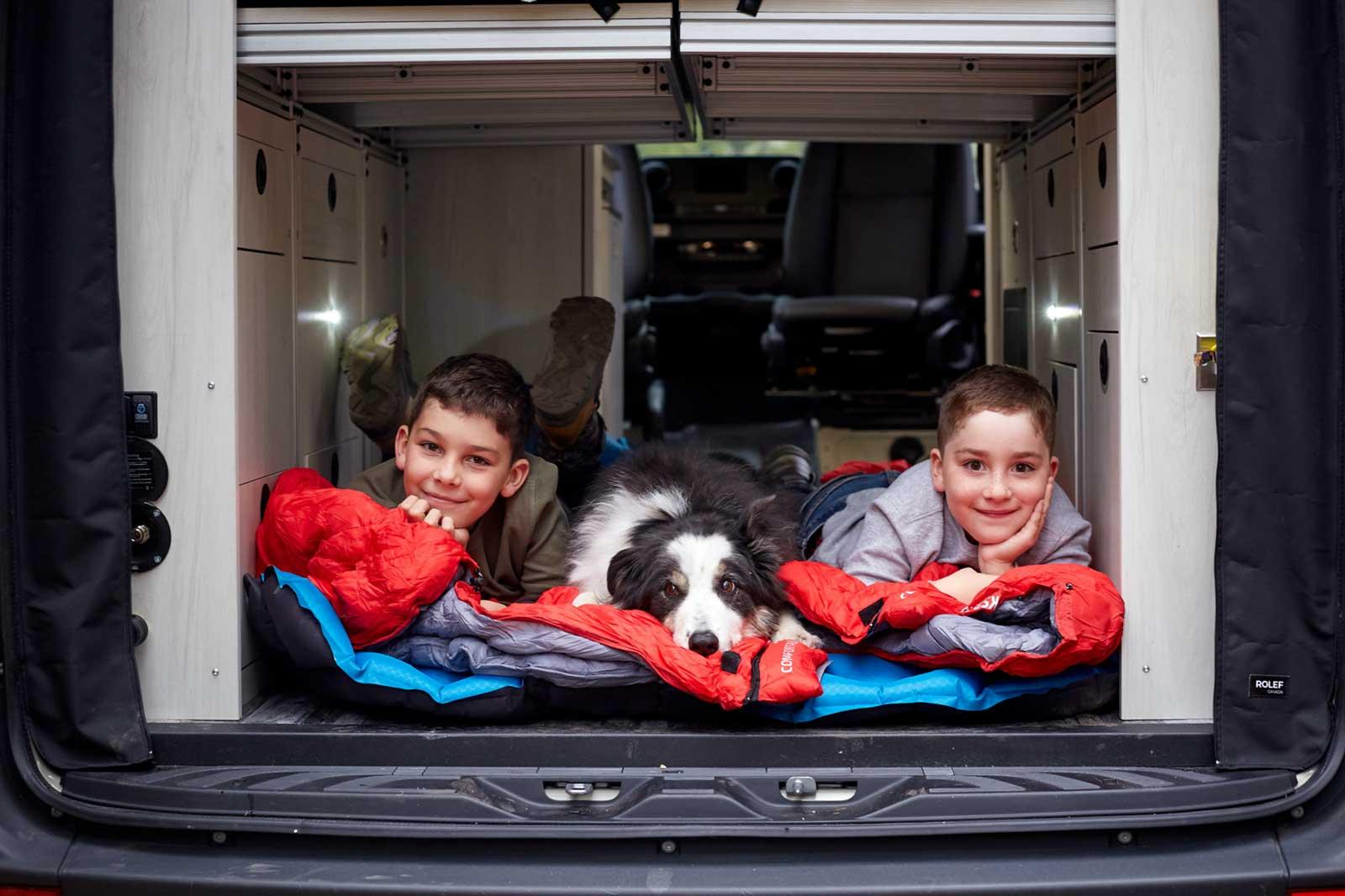Kids and a dog in the back of an Antero Adventure Van